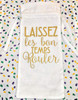 Creole Foods of Louisiana Mini King Cake Date Night, white linen bag with gold script that says 'Laissez les bon temps rouler' against a colorful confetti backdrop.