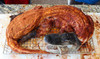 Creole Foods of Louisiana Whole Skinned Alligator Large 12 - 20 lbs, large skinned alligator prepared for cooking on a wire rack.