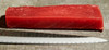 JV Foods Yellowfin Tuna Saku, fresh red tuna fillet on a textured surface with a knife.