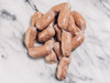 The Best Stop Party Links 32oz, raw sausage links on a marble surface.