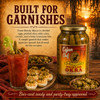 Cajun Chef Pickled Okra 64oz, a glass jar filled with sliced pickled okra, positioned next to a glass of Bloody Mary garnished with pickled okra and a bowl of whole pickled okra, set against a scenic sunset background.
