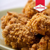 Louisiana Fish Fry Extra Crispy Chicken Fry 9oz, close-up of crispy, golden-brown seasoned chicken pieces on a plate.