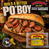 Savoie's Smoked Green Onion Sausage 16oz., packaged smoked sausage with green onions in clear plastic wrapper on a wooden serving board with a sandwich filled with sausage, peppers, and onions.
