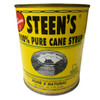 Steen's Pure Cane Syrup 25oz Can, yellow can with black text and a black and white illustration of a house with trees around it.