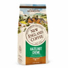 New England Coffee Hazelnut Creme Decaf Ground 10 oz, ground coffee package with illustrated countryside scene, featuring houses and hills, label indicating medium roast and decaffeinated flavor.