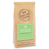 New England Coffee Pistachio Ice Cream, brown coffee bag with green and white label showcasing the product name and flavor
