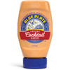 Blue Plate Creamy Cocktail Sauce 12 oz, a squeeze bottle of creamy orange cocktail sauce with specks of spices, featuring a blue cap and a detailed label with a boat, a bird, and the brand's logo.