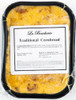 La Boucherie Jalapeno Cornbread Dressing 2 lb, packaged cornbread dressing with a golden-yellow crust, in a black baking dish with a label on top.