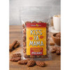 Kiss Ya Mama Pecans 4oz, transparent resealable bag of cinnamon sugar pecans with scattered pecans around it on a wooden surface.