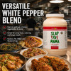 Slap Ya Mama White Pepper Blend Cajun Seasoning 8 lb Food Service Jug, beige plastic container with red and green label, in a busy kitchen setting for versatile seasoning use.