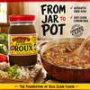 Savoies Dark Roux 16oz, jar of authentic dark roux with a kitchen scene showing a cooked Cajun dish and fresh vegetables.