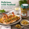 Boscoli Jalapeno Olive Salad 15.5oz, jar of chopped jalapeno olives with a dish of grilled fish topped with jalapeno olive salad and cooked shrimp on a plate