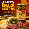 Cajun Chef Whole Hot Jalapeño Peppers, jar of spicy green jalapeño peppers on a wooden board with assorted cheeses, meats, and crackers for snacks.