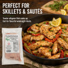 Alligator Filets 1lb, packaged fresh alligator meat fillets in white vacuum-sealed packaging, served as part of a delicious skillet dish with colorful peppers, onions, and lemon wedges.