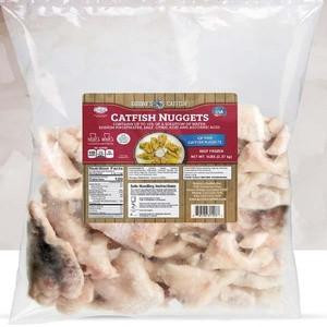 Guidrys Catfish Nuggets 5lb, raw frozen catfish nuggets in a clear bag with a label featuring product details and brand logo.