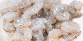 JV Foods Gulf Shrimp P&D 31/35 Ct 5lb, raw peeled and deveined shrimp on a white surface.