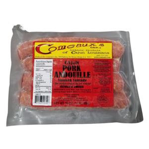 COMEAUX'S Pork Andouille, packaged smoked sausage meat in a clear vacuum-sealed plastic bag with red and yellow label.