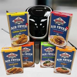 Air Fryer Sampler Pack, various flavored air fryer meal packs including Lemon Pepper, Barbecue, Fish, Chicken, and Pork, with an air fryer appliance in the background