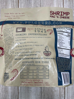 Legacy Foods Legacy Shrimp Mac & Cheese 26oz, unopened package with cooking instructions and nutrition facts on a beige background.