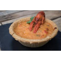 Broussard's Bayou Broussards Bayou Company Crawfish Pie 11oz, a savory crawfish pie topped with a whole cooked crawfish on a rustic wooden surface.