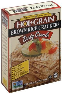 Conrad Rice Mill Hol Grain Rice Crackers Zesty Creole 4.5oz, box of gluten-free and non-GMO brown rice crackers with zesty creole flavor, featuring an image of a cracker topped with a slice of cucumber, tomato, and basil.