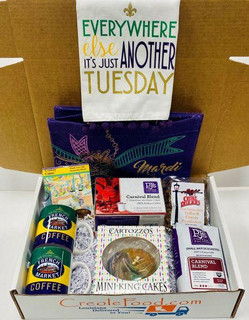 Creole Foods of Louisiana Everywhere Else is Just Another Tuesday Gift Box, a gift box filled with Louisiana-themed snacks and treats including Mardi Gras-themed items, coffee mugs, mini king cakes, and assorted candies.