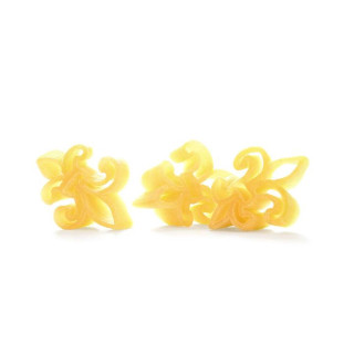 D'Agostino's Fleur de Lis Shaped Pasta, yellow pasta shaped like fleur de lis symbols arranged on a white background.