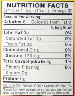 Cajun Power Garlic Sauce 16oz, nutritional facts label showing serving size, calories, fats, cholesterol, sodium, carbohydrates, sugars, and protein content.