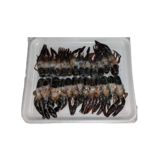 Soft Shell Crawfish, fresh live crawfish with shells intact arranged on a styrofoam tray.