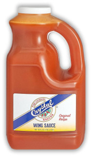 Crystal Wing Sauce Gallon, large orange plastic container with handle and white screw cap, labeled with Crystal Sauces branding and Wing Sauce description.