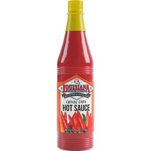 Louisiana Fish Fry Cravin Cajun Hot Sauce 6oz, a tall red plastic bottle with a yellow cap featuring bold label design and images of red peppers.