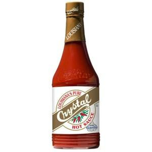 Crystal Louisiana Pure Hot Sauce with Garlic 12 Ounce, bottle featuring a red chili pepper design and labeled with the product name and flavor.