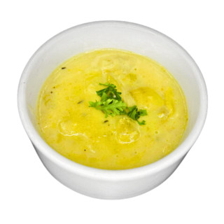 Carnival - Creole Artichoke Soup 4lb, a bowl of creamy yellow artichoke soup garnished with fresh green herbs.