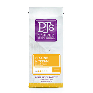 PJ's Coffee PJ's Praline & Cream coffee, packaged coffee bag with purple and yellow labels, whole bean and ground options, 16 ounces.
