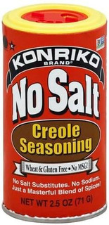 Conrad Rice Mill Konriko NO SALT CREOLE SEASONING 2.5 oz, front view of the cylindrical red spice container with a yellow lid and bold label.