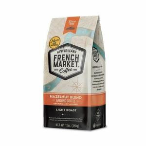 French Market Coffee Flavored Hazelnut 12 oz, a bag of ground coffee with a beige and orange design, featuring the product name and flavor prominently on the front.