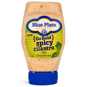 Blue Plate Go Bold Sauce Spicy Cilantro, a 12 oz bottle of spicy cilantro sauce in a squeezable plastic container with a blue cap and colorful label.