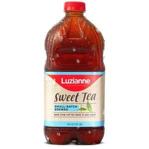 Luzianne Ready to Drink Sweet Tea 64 oz, a plastic bottle of sweet tea with a red cap and a label featuring the Luzianne logo and a refreshing image of a tea leaf.