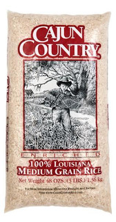 Cajun Country Medium Grain Rice 3lb, package featuring a black and white image of a young boy holding a chicken outdoors.
