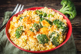 La Boucherie Broccoli & Rice 2lbs, cooked broccoli and rice dish in a red bowl