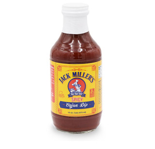 Jack Miller's Spicy Cajun Dip 16oz, a glass bottle of rich, red Cajun-style spicy dip with a white screw cap and a bright yellow label.