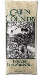 Cajun Country Popcorn Long Grain Rice 1lb, image showing a bag of long grain rice with a black and white illustration of a young boy playing an accordion in a rural outdoor setting.