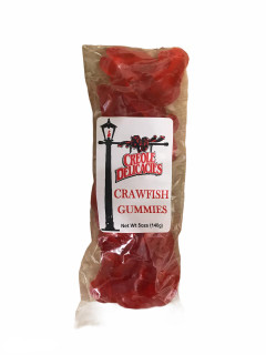 Creole Delicacies Crawfish Gummies 5oz, red gummy crawfish candies in a clear plastic bag with a white label featuring a black lamppost and the product name.