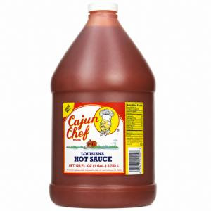 Cajun Chef Louisiana Hot Sauce 128oz, a large plastic bottle with red hot sauce and a yellow label featuring a chef mascot and product details.