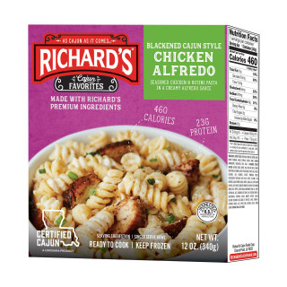 Richard's Blackened Cajun Chicken Alfredo 12oz, packaged frozen pasta meal featuring seasoned chicken, rotini pasta, and Alfredo sauce with green garnishes.