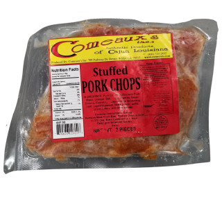 Comeaux's Stuffed Pork Chops with Pork Dressing, packaged raw pork chops stuffed with seasoned pork and herbs in vacuum-sealed plastic.