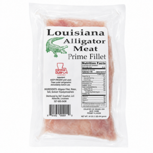Gator World Alligator Filets 1lb, frozen alligator meat in clear vacuum-sealed packaging with a label featuring a cartoon alligator chef, nutritional info, and USDA certification.
