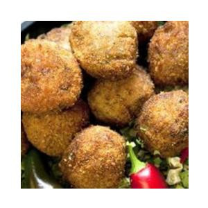 Comeaux's Boudin Balls Pork 144 Ct, close-up of golden fried pork boudin balls served on a platter with vegetables.