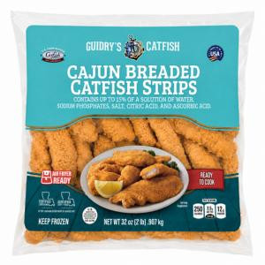 Guidrys Breaded Catfish Strips 2lb, package of crispy breaded catfish fillets in a clear plastic bag with blue label, lemon wedge, and dipping sauce shown in the image.