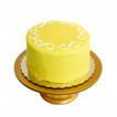 Gambino's Lemon Doberge Cake, a small round cake with vibrant yellow lemon-flavored icing and decorative lemon slice on top.